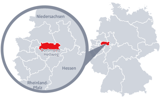 Diese Grafik zeigt eine Karte von Deutschland mit einer detaillierten Ansicht der Region Dortmund-Hellweg. Dortmund-Hellweg ist in Rot hervorgehoben und liegt im westlichen Teil Deutschlands. Ein Lupensymbol vergrößert diesen Bereich, um die Lage genauer darzustellen.
